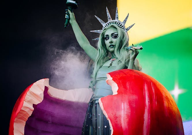 Chappell Roan performing dressed as the Statue of Liberty at the 2024 Governors Ball in NYC.  Getty Images. / chappell roan tour outfits
