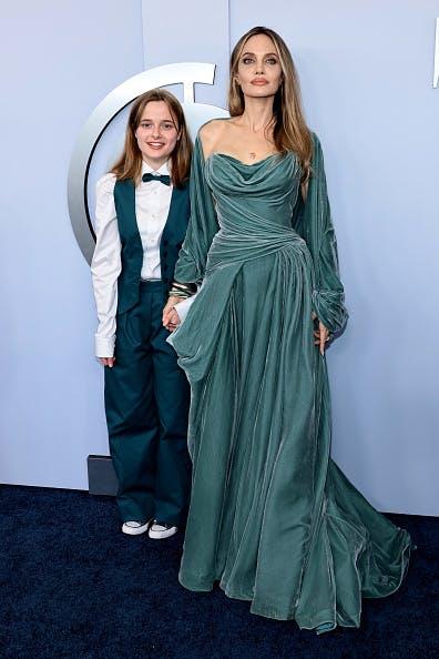 Angelina Jolie in a teal draped gown and her daughter Vivienne in a teal suit and bowtie at the 2024 Tony Awards. Getty Images.