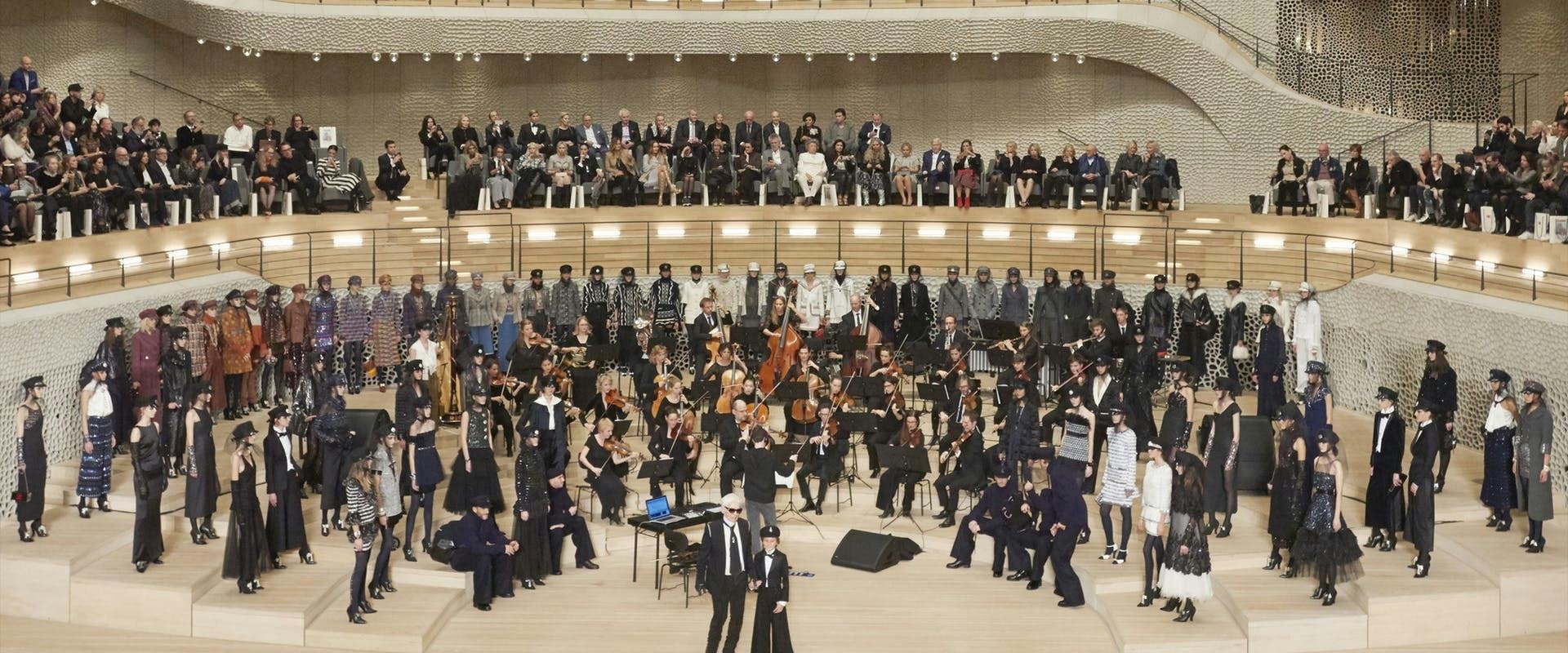 room indoors person human crowd theater orchestra concert musical instrument