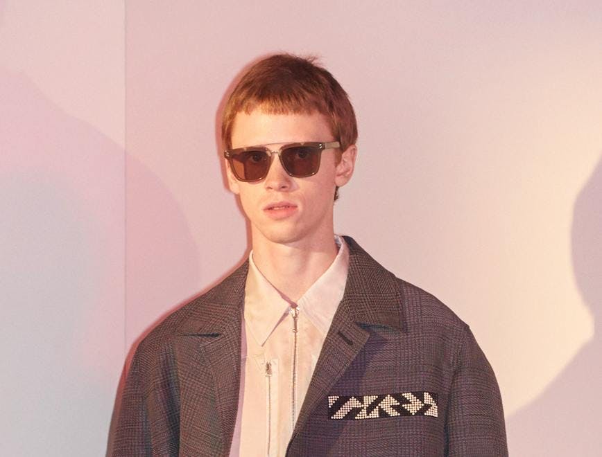 sunglasses accessories person suit coat overcoat clothing man jacket blazer