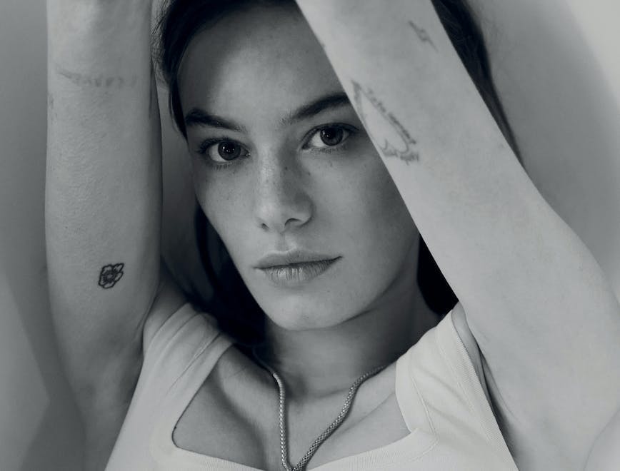 Camille Rowe in a black and white image.