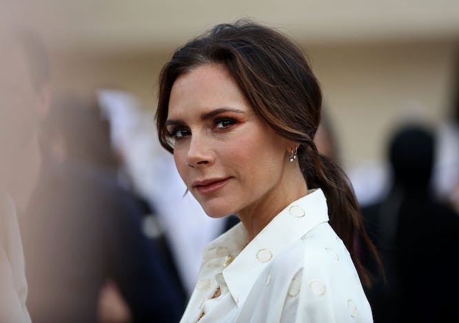 Victoria Beckham with a ponytail and white shirt