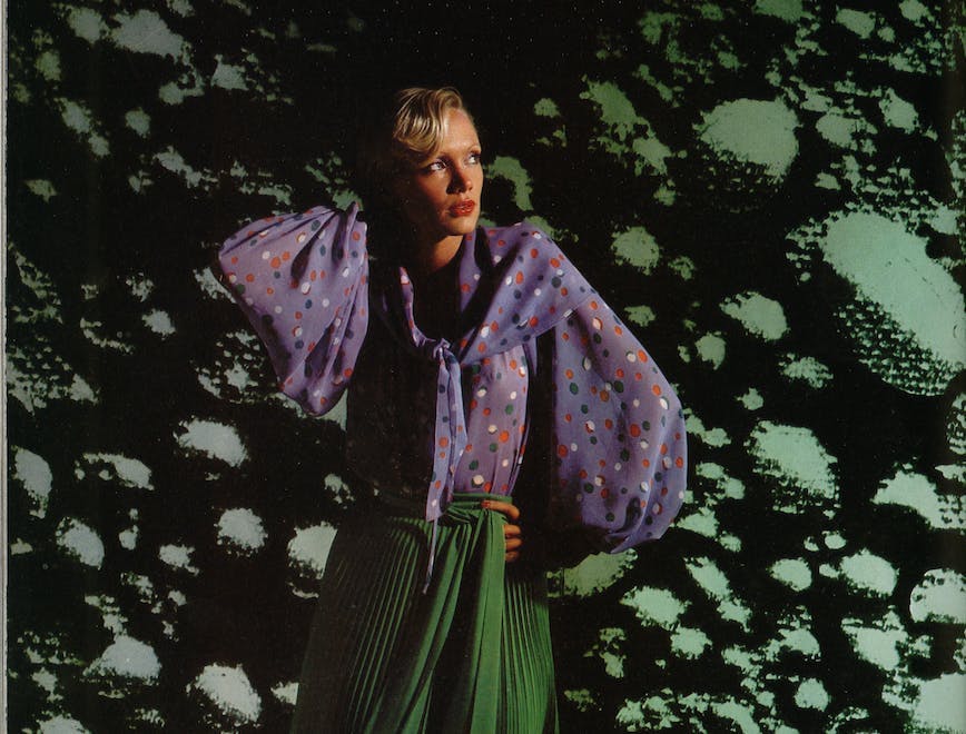 A model wears Yves Saint Laurent in a 1976 issue of L'OFFICIEL Paris, photographed by Patrick Bertrand.
