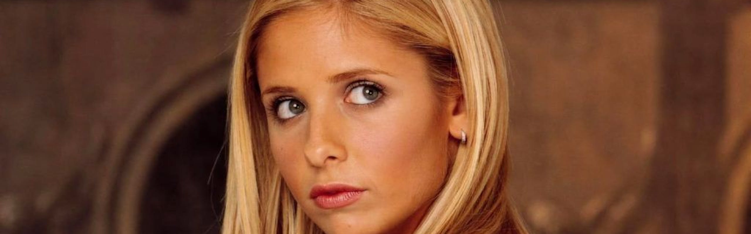 Sarah Michelle Gellar wears a white long sleeve top for her role as Buffy the Vampire Slayer.