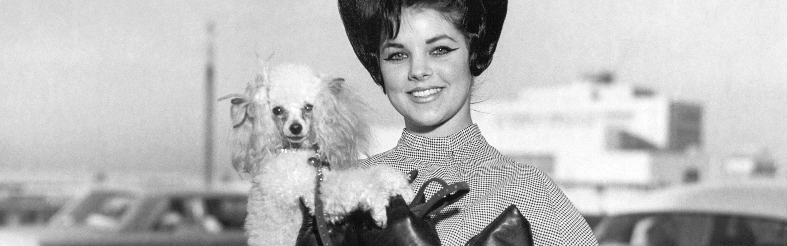 Priscilla Presley Young with dog and gloves