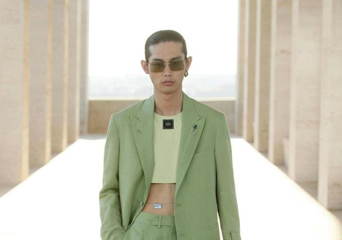 clothing suit coat overcoat blazer jacket sunglasses accessories person sleeve