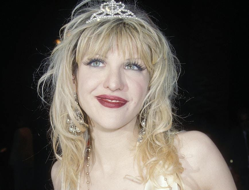 Courtney love in a tiara and silk blouse