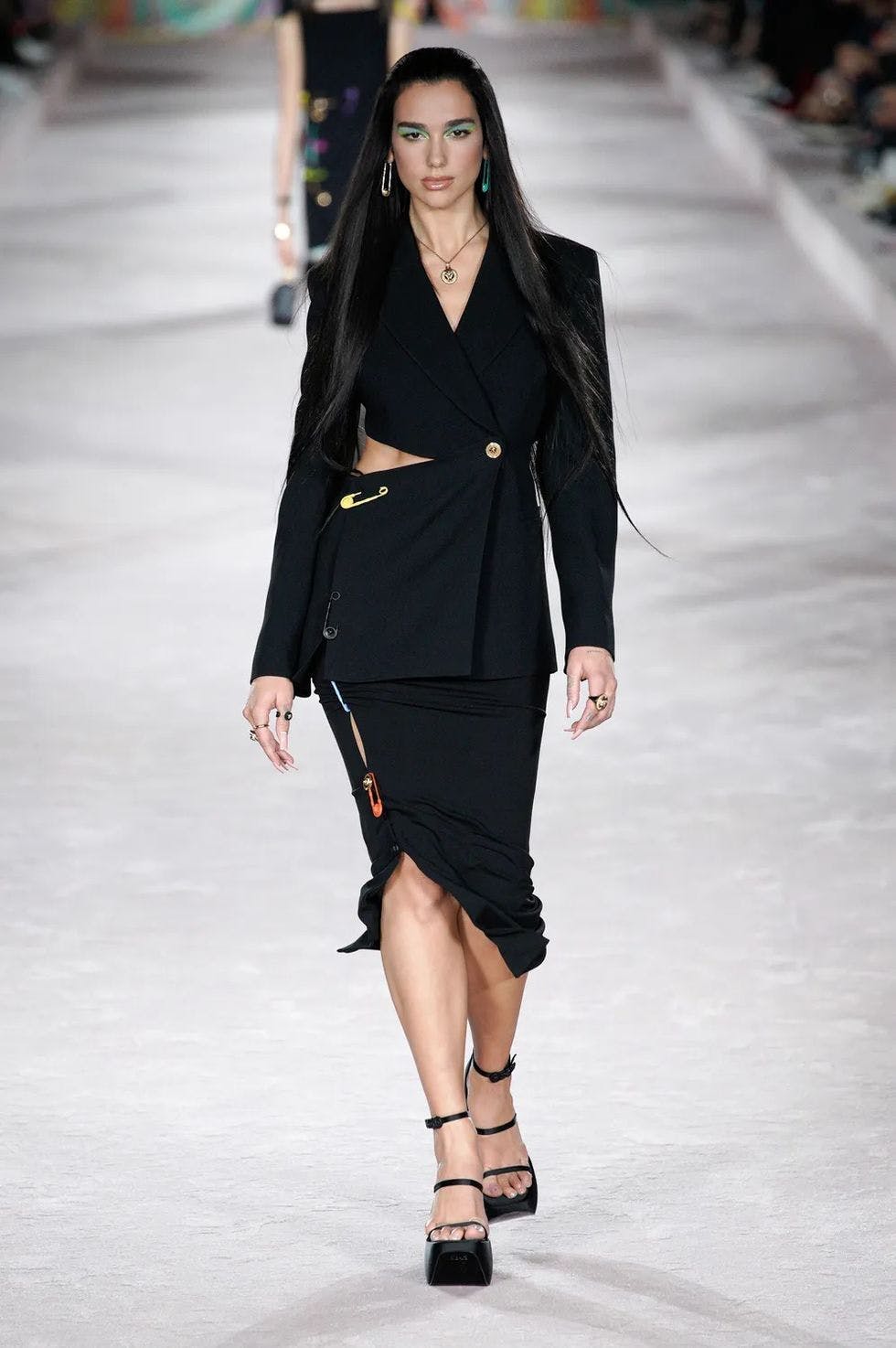 female person dress clothing woman runway coat sleeve suit overcoat