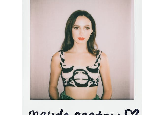 Polaroid of Maude Apatow in a black and white top