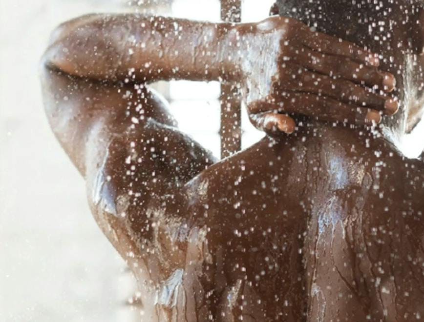 man showering with water
