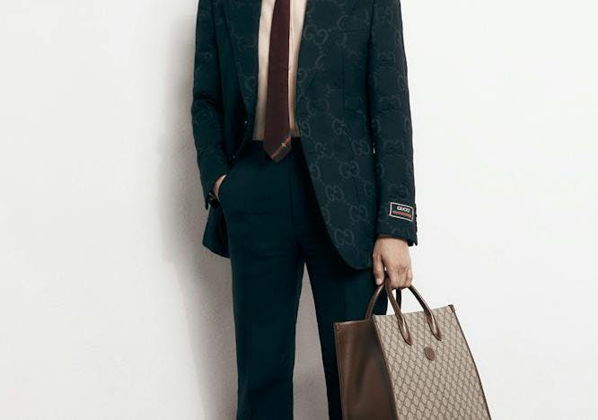 suit clothing overcoat coat apparel tie accessories person man tuxedo