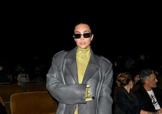 milan clothing apparel person sunglasses accessories overcoat coat shoe footwear suit