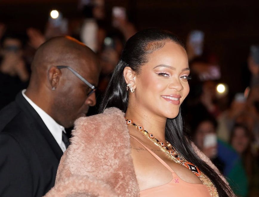Rihanna in a pink coat and a pink dress