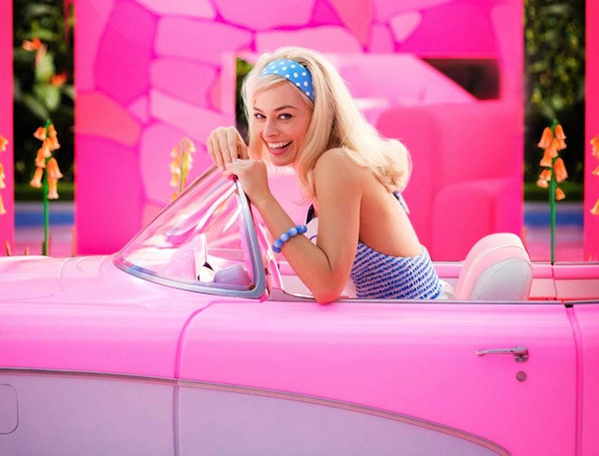 Margot Robbie as Barbie in hot pink car