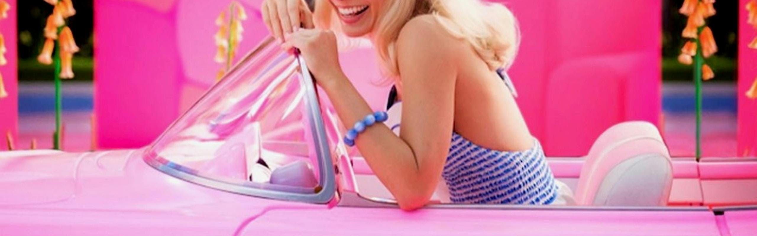 Margot Robbie in a pink convertible for the Barbie Movie