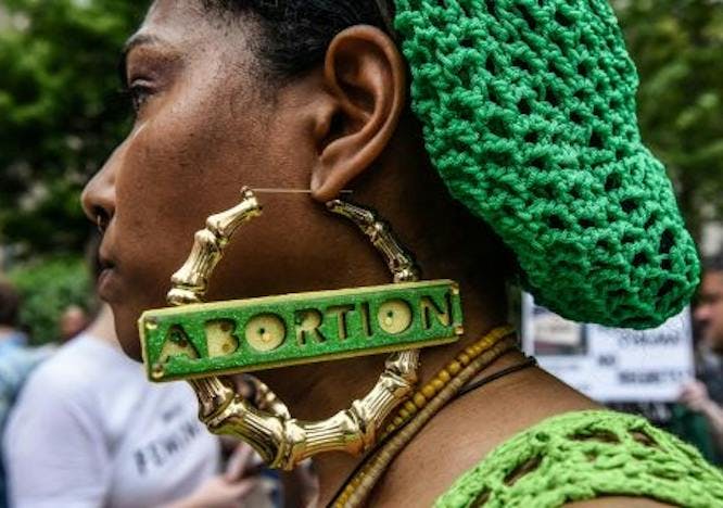 Earring that says abortion. 