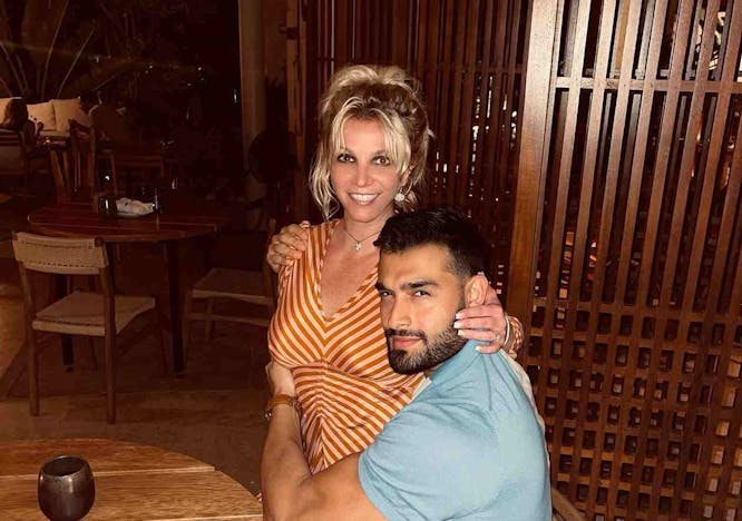 Britney Spears and Sam Asghari pose together for a photograph.