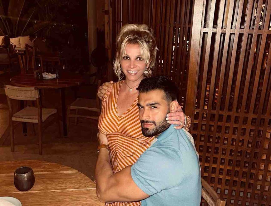 Britney Spears and Sam Asghari pose together for a photograph.