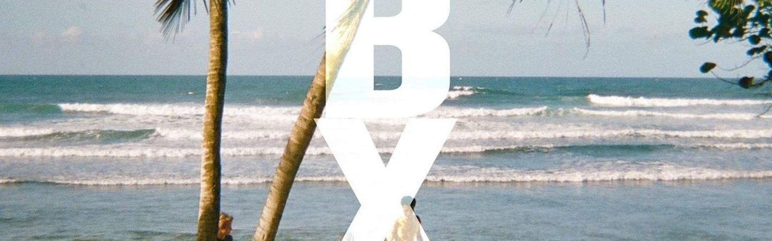 A promo poster for Outer Banks 3-- viewers can see the ocean, palm trees, and the Pogues sitting in a circle on the beach. 