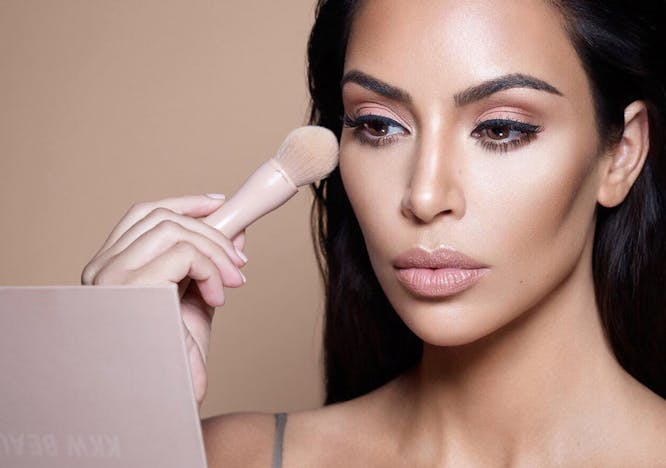 Kim Kardashian applying makeup