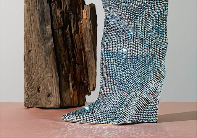 Blue studded boot on grey background