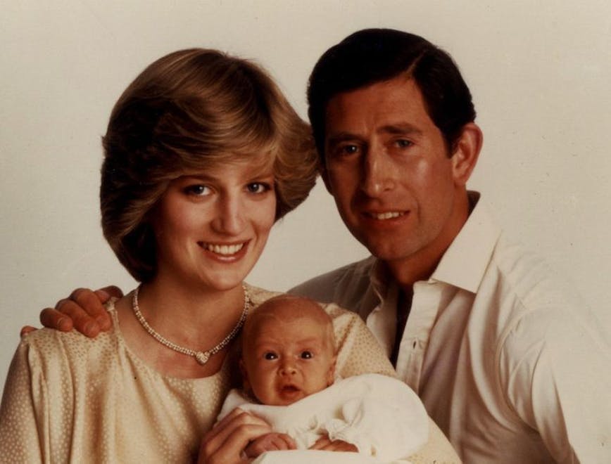 diana and charles holding baby
