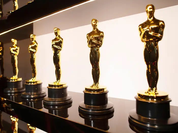5 gold Oscar statuettes