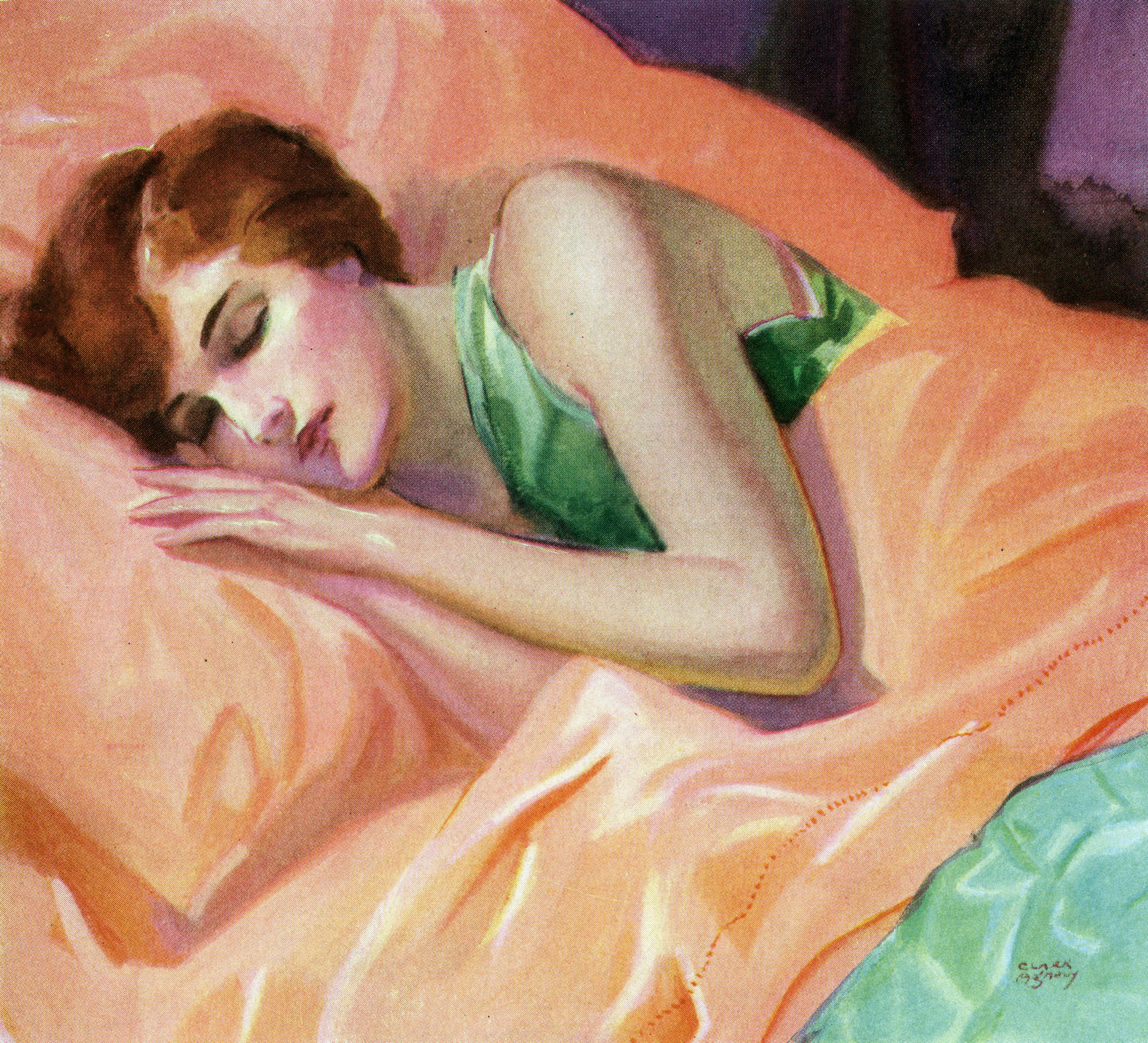 Woman wears green top and sleeps on peach colored sheets.