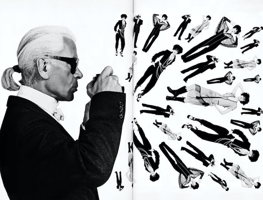 Abstract photo of Karl Lagerfeld talking picture of several women