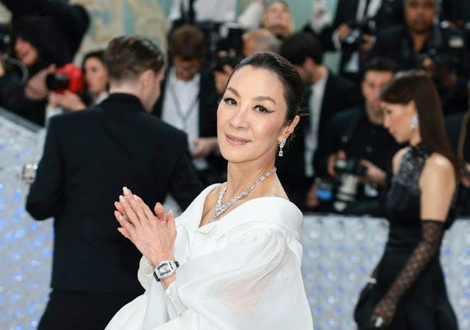 Michelle Yeoh in a black and white dress.
