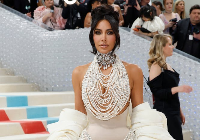 Kim kardashian in pearl dress at 2023 Met gala.