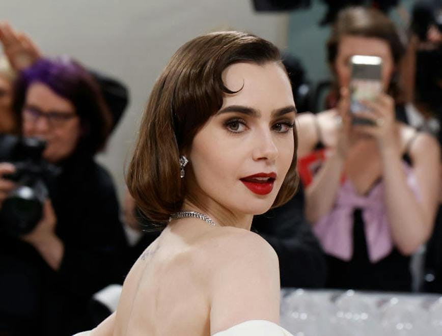 Lily Collins in a black and white gown.