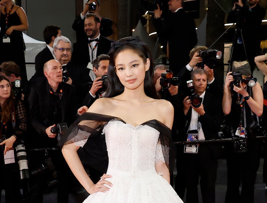 Jennie in a white and black dress at Cannes.