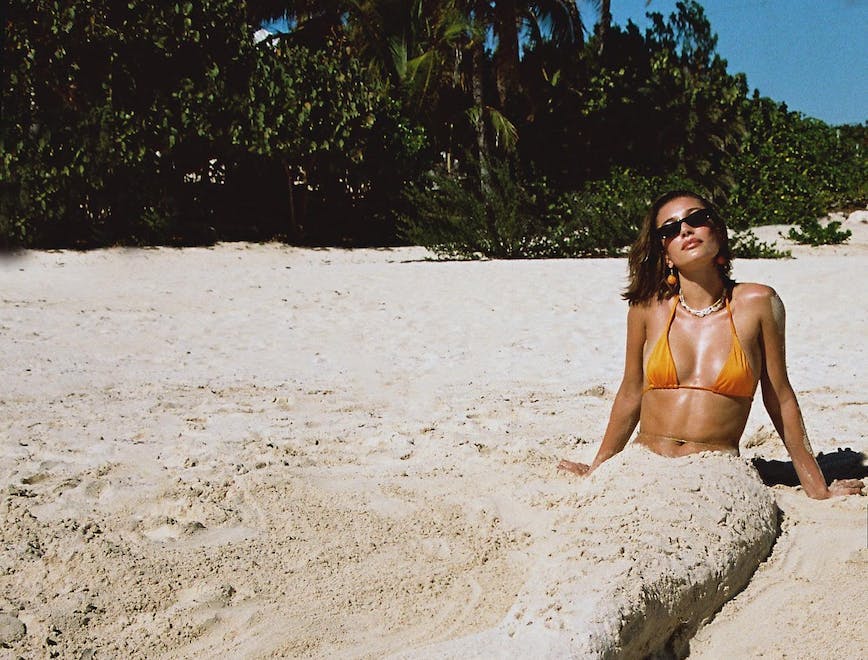 Hailey Bieber channels her inner mermaid in flaming orange bikini.