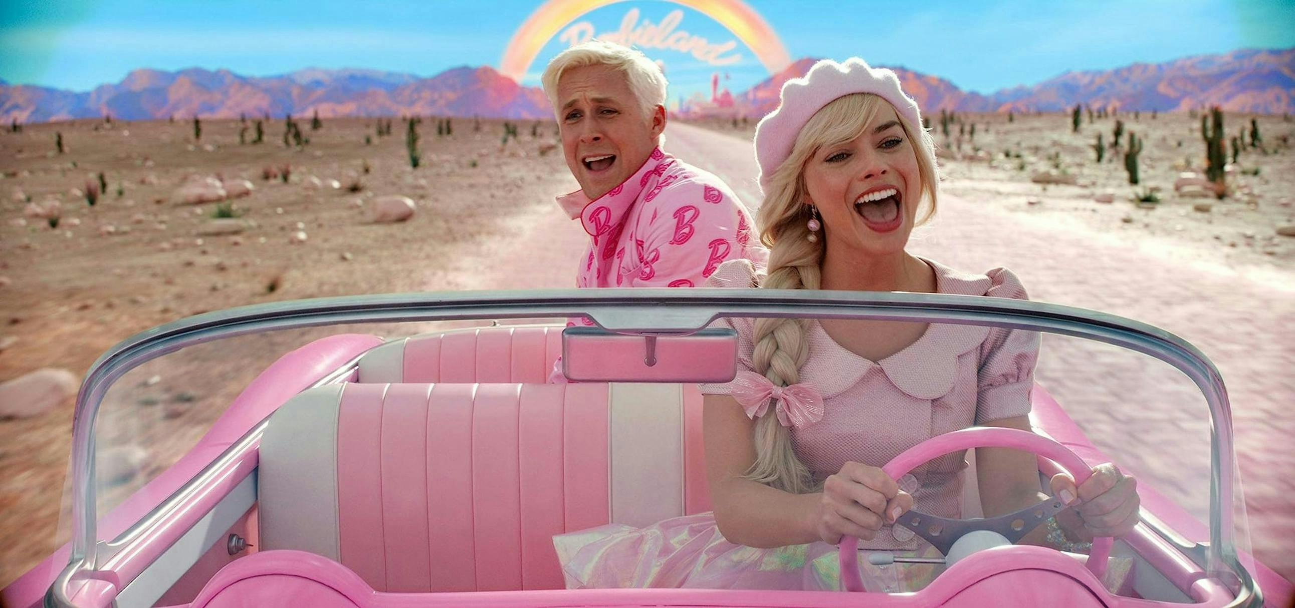 Barbie and Ken driving in a car through Barbie Land