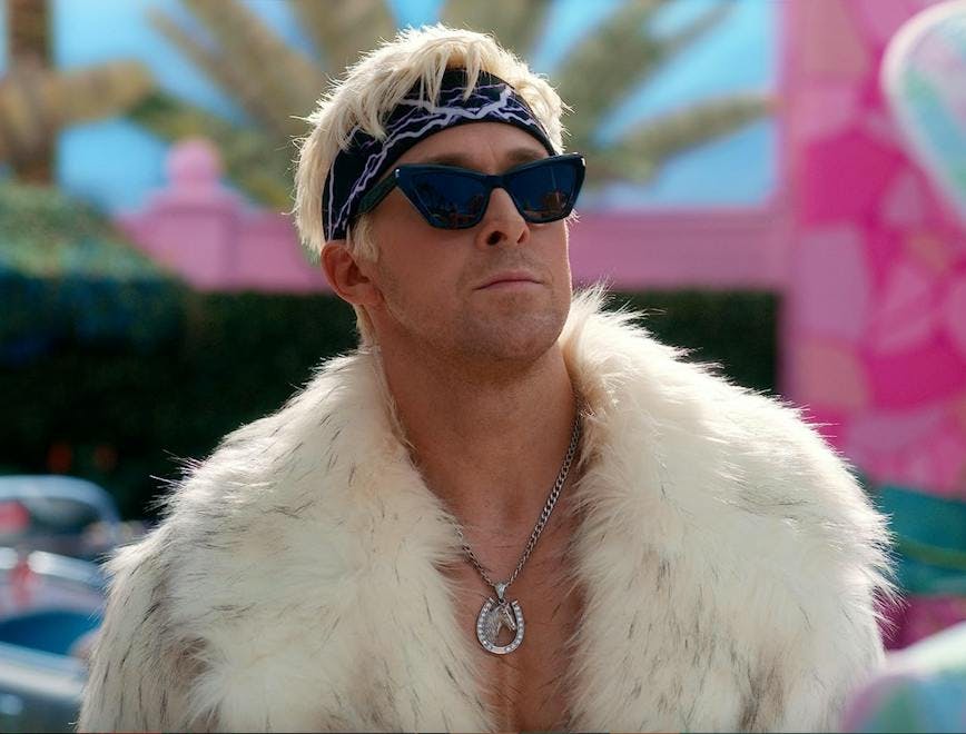 Ryan Gosling dressing like Ken in fur coat and black sunglasses