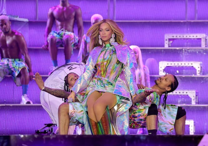 beyonce in sequin mini dress and cape concert couture