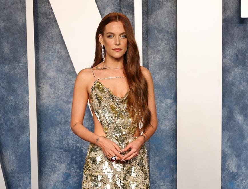 Riley keough in gold dress; revealed baby name