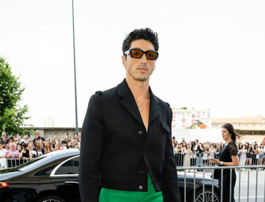 taylor zahkar perez best fashion moments; black blazer and green pants
