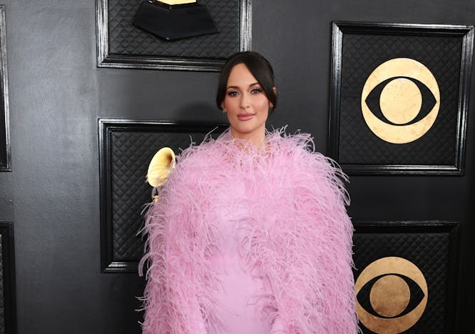 kacey musgraves in pink feather coat and catsuit