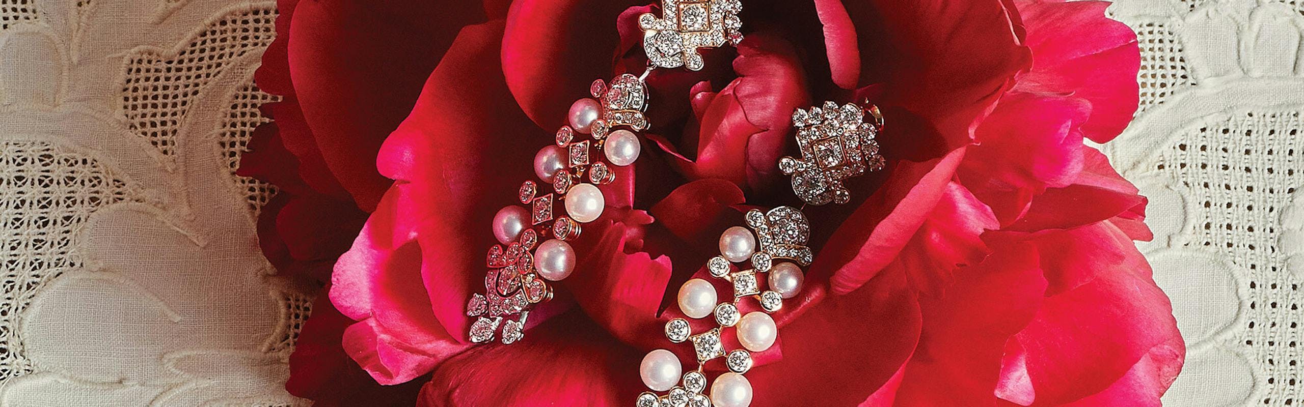 pearl and diamond earrings on rose