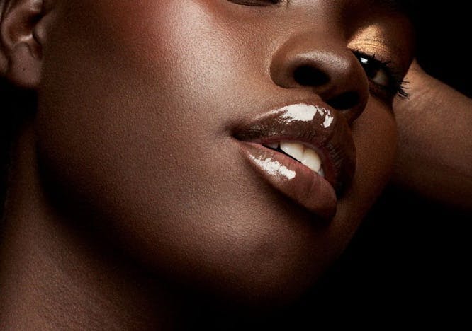 model in gold eyeshadow and blush; new august beauty products 2023