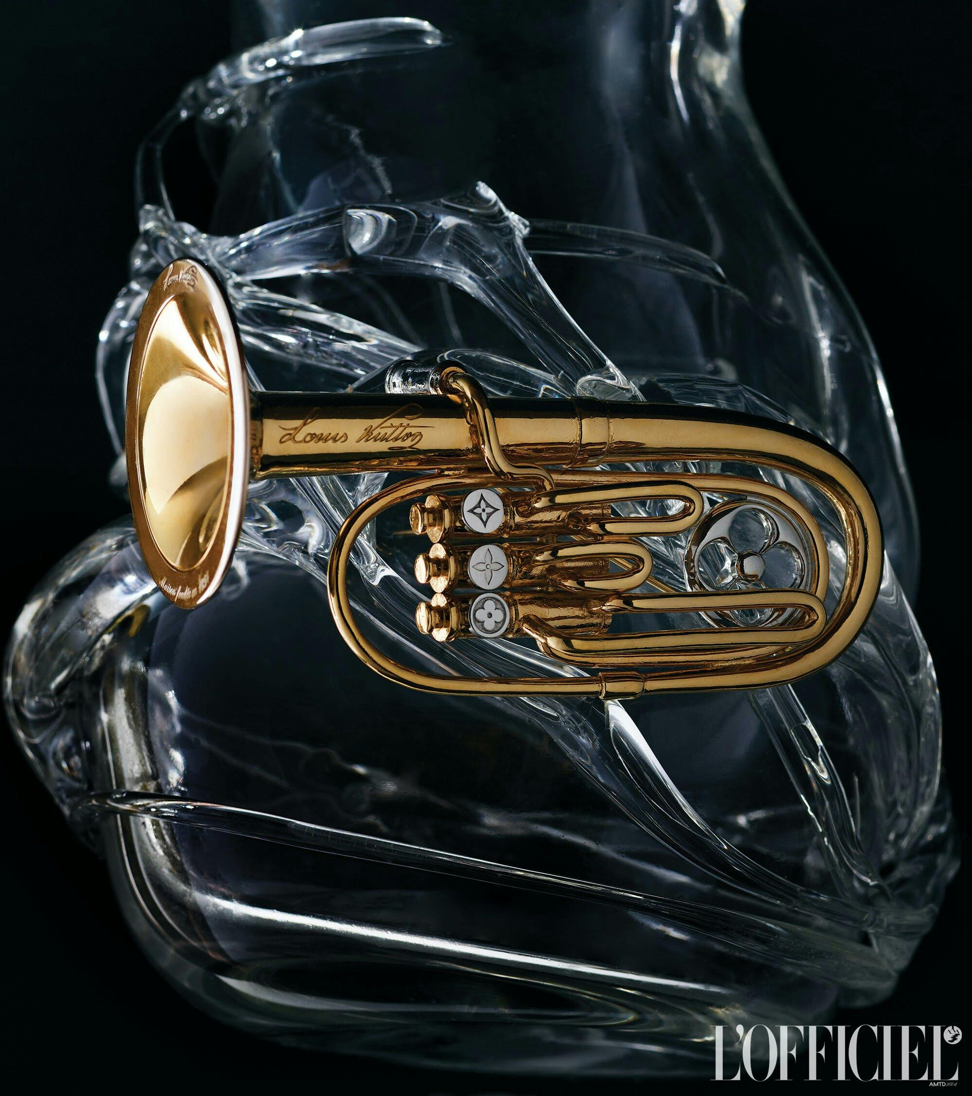 a trumpet shaped brooch against a dark backdrop