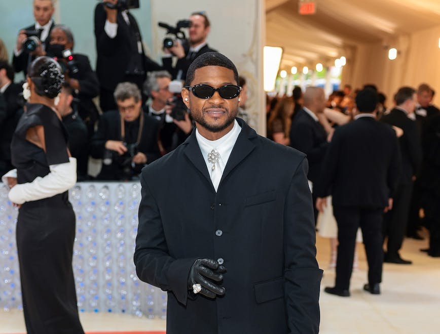 usher in a black suit