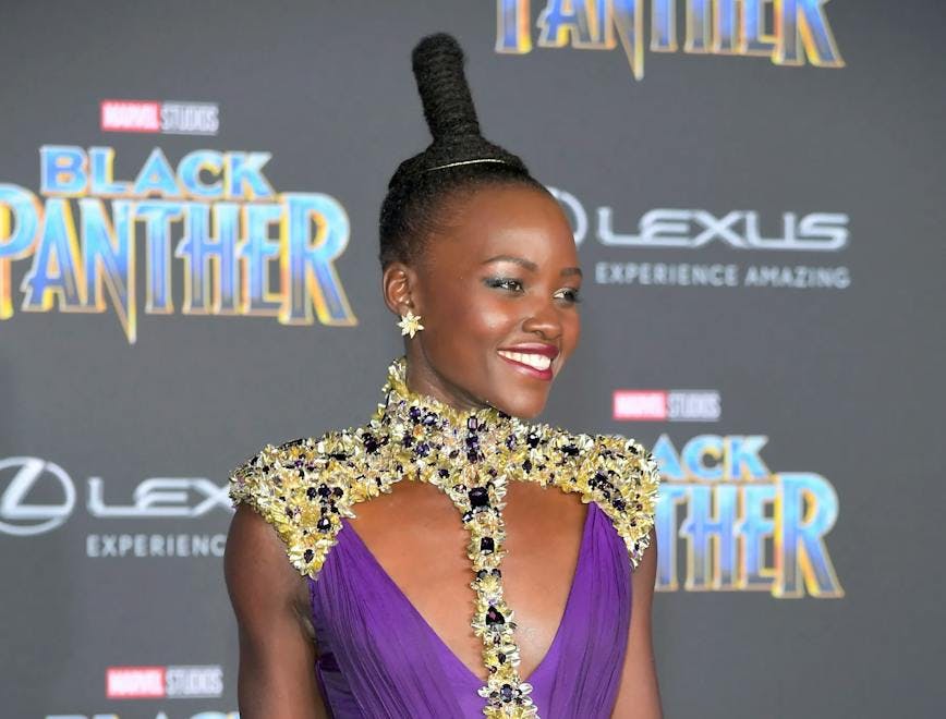 lupita in a purple gown and updo; break up; joshua jackson