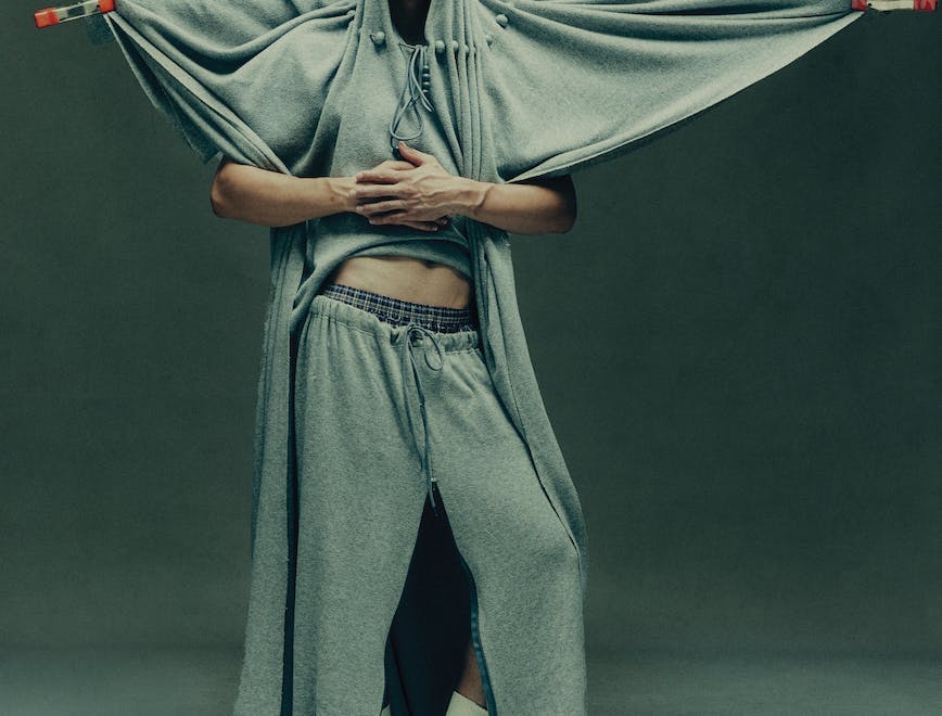 Model in sweats hanging on a clothesline