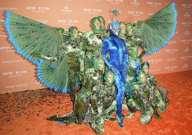 heidi klum dressed as a giant peacock for 2023 halloween costume