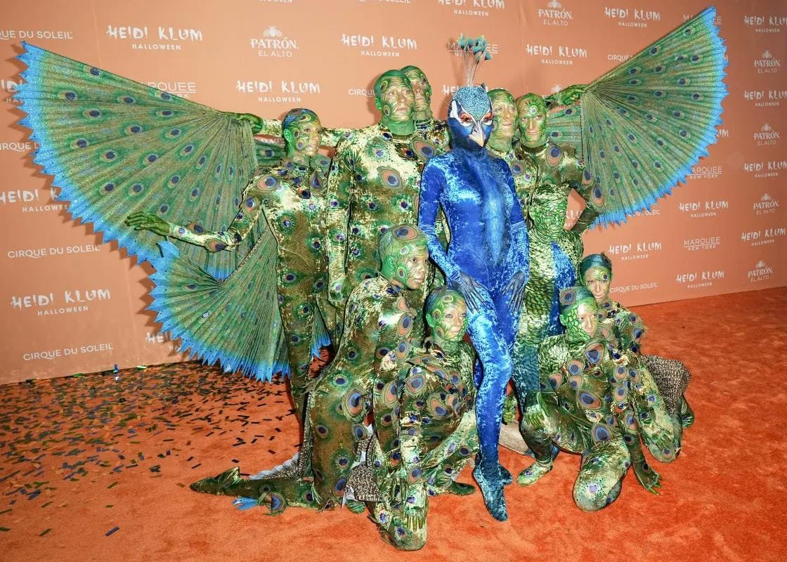 heidi klum dressed as a giant peacock for 2023 halloween costume