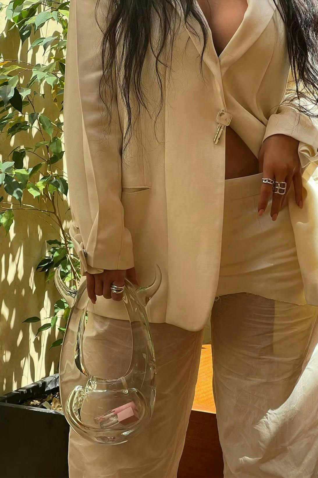 unique designer handbags kylie jenner holding glass bag wearing white suit set