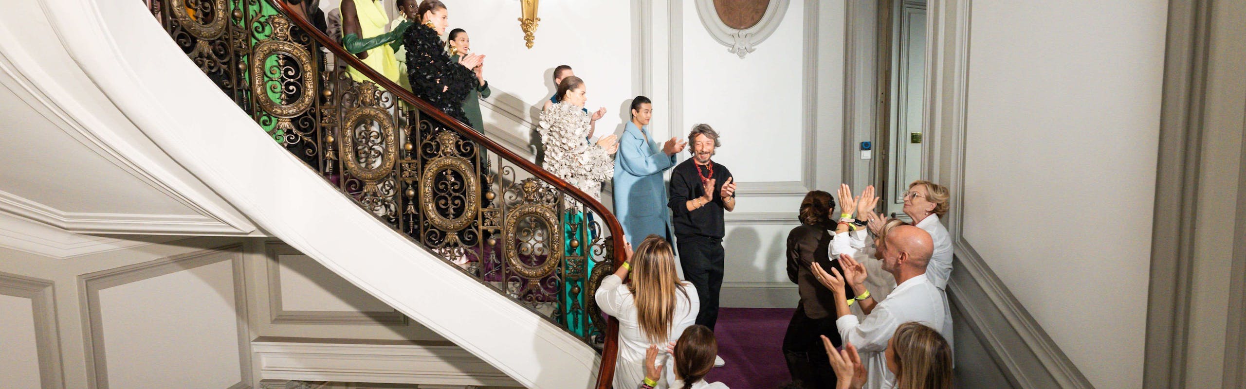 Models on the stairs of the Valentino salon.